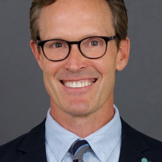 picture of Ben, wearing glasses, smiling