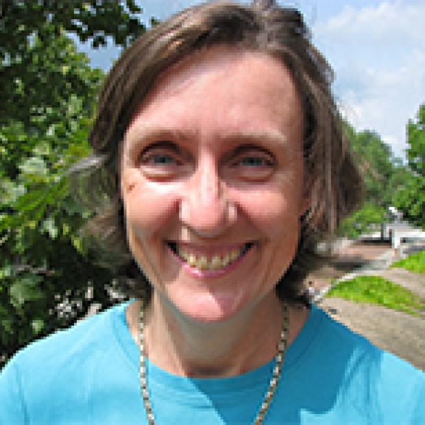 picture of Thamora, smiling, outside, wearing a bright blue shirt