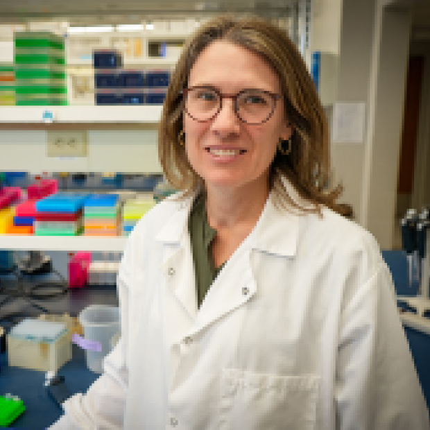 picture of Mandi, wearing lab coat and glasses